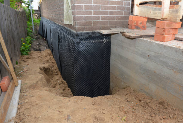 Happy homeowners after waterproofing job in Grandview
